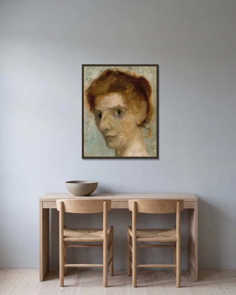 Selbstporträt von Paula Modersohn-Becker gerahmt an einer Wand