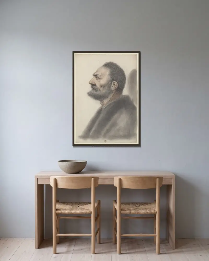 Homme à la barbe courte et aux cheveux frisés, la tête légèrement relevée, de profil à gauche av Nicolas Lagneau inramad på en vägg