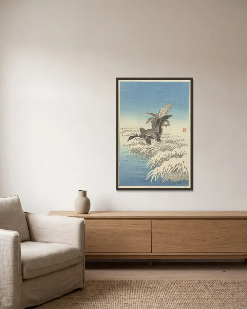 Flock of ducks flying above snowy reed collar av Ohara Koson inramad på en vägg