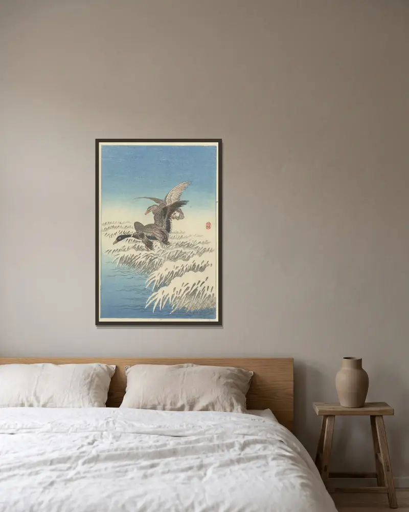 Flock of ducks flying above snowy reed collar av Ohara Koson inramad på en vägg