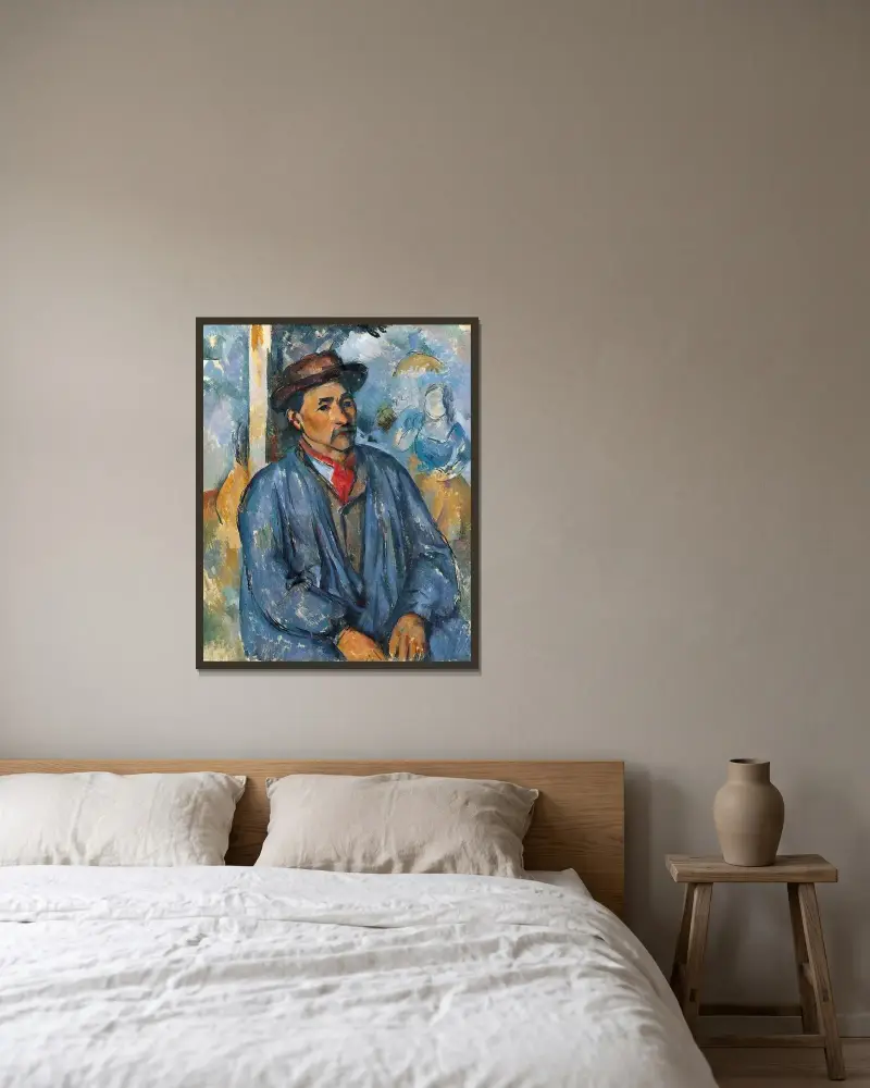 Mann im blauen Arbeitskittel von Paul Cézanne gerahmt an einer Wand