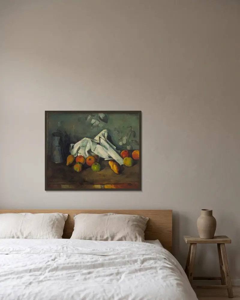 Milchkanne und Äpfel von Paul Cézanne gerahmt an einer Wand