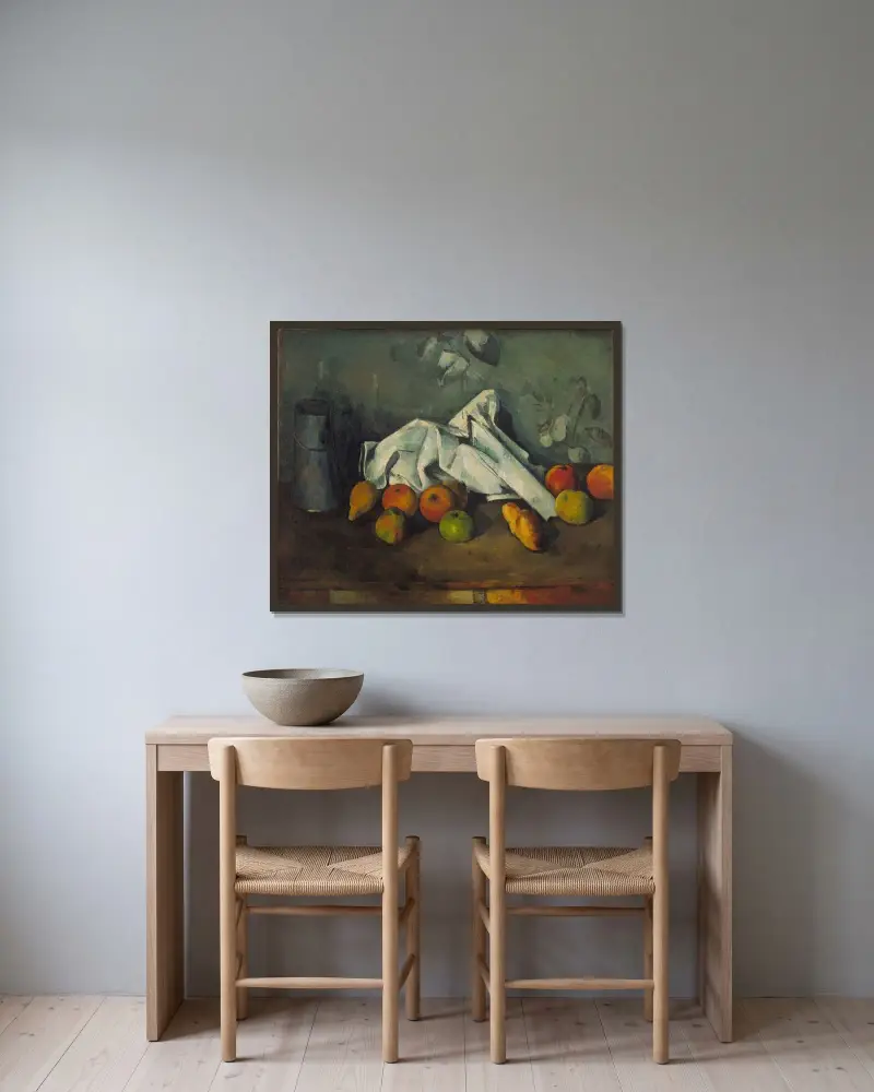 Milchkanne und Äpfel von Paul Cézanne gerahmt an einer Wand