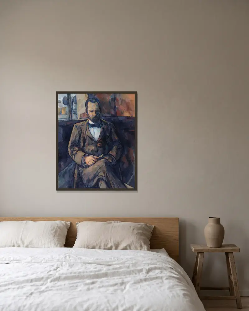 Portrait d’Ambroise Vollard av Paul Cézanne inramad på en vägg