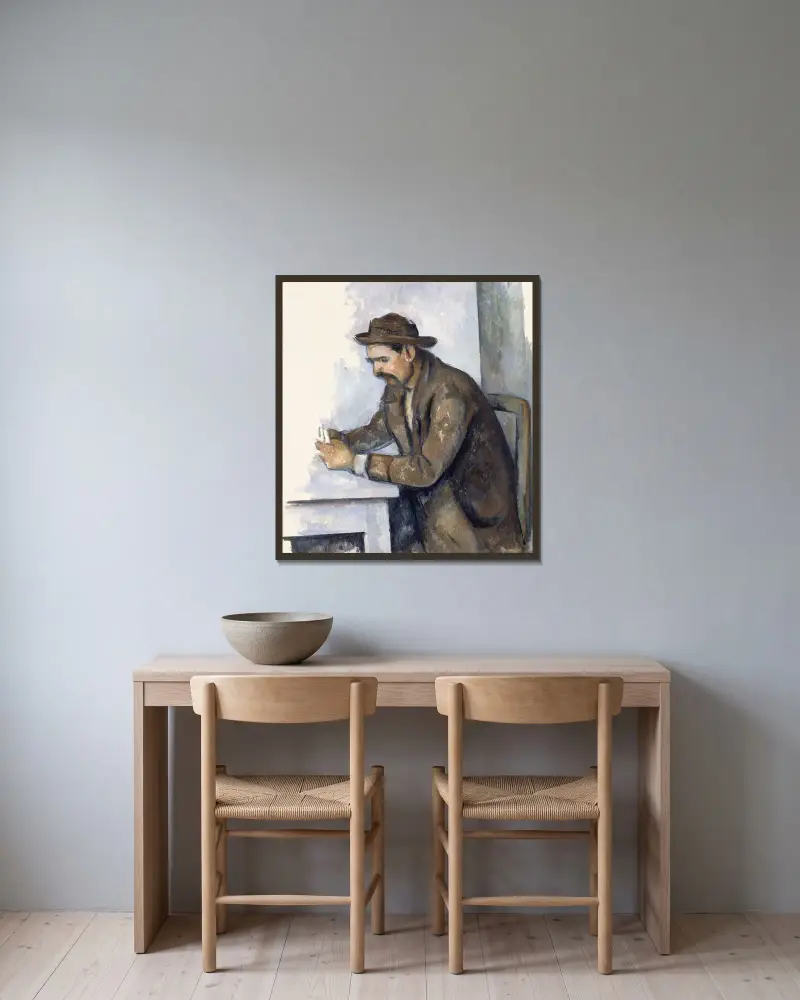 Der Kartenspieler von Paul Cézanne gerahmt an einer Wand