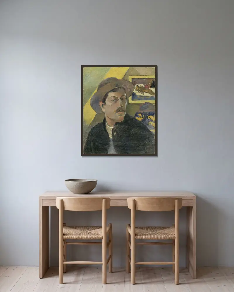 Self-portrait with a hat av Paul Gauguin inramad på en vägg