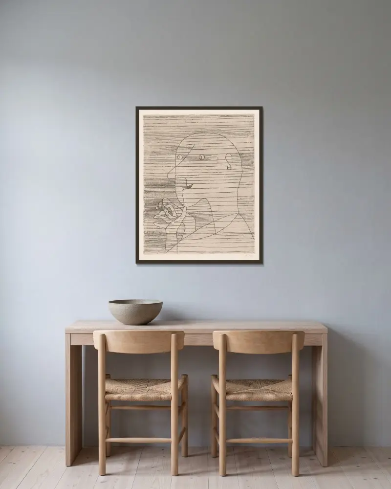 Der rechnende Greis von Paul Klee gerahmt an einer Wand
