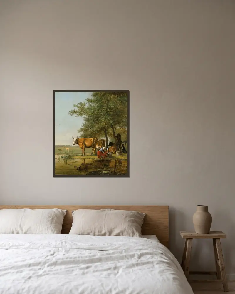 Landskap med boskap och en kvinna som rengör en hink vid en bäck av Paulus Potter inramad på en vägg