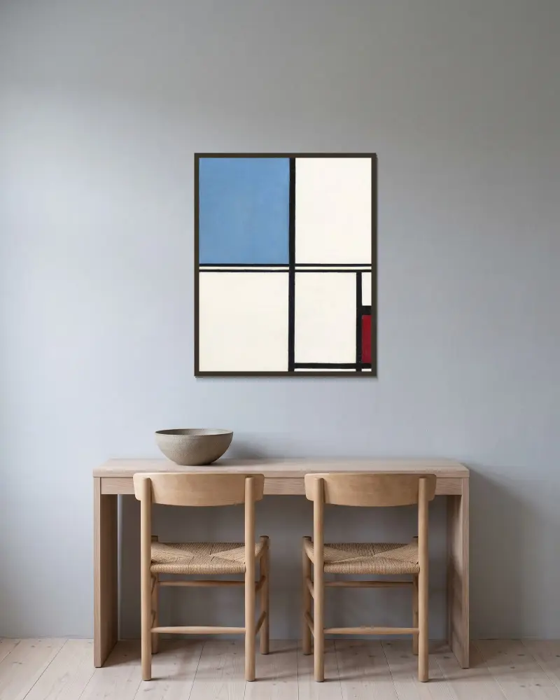 Kompozycja z niebieskim i czerwonym, Piet Mondrian w ramie na ścianie