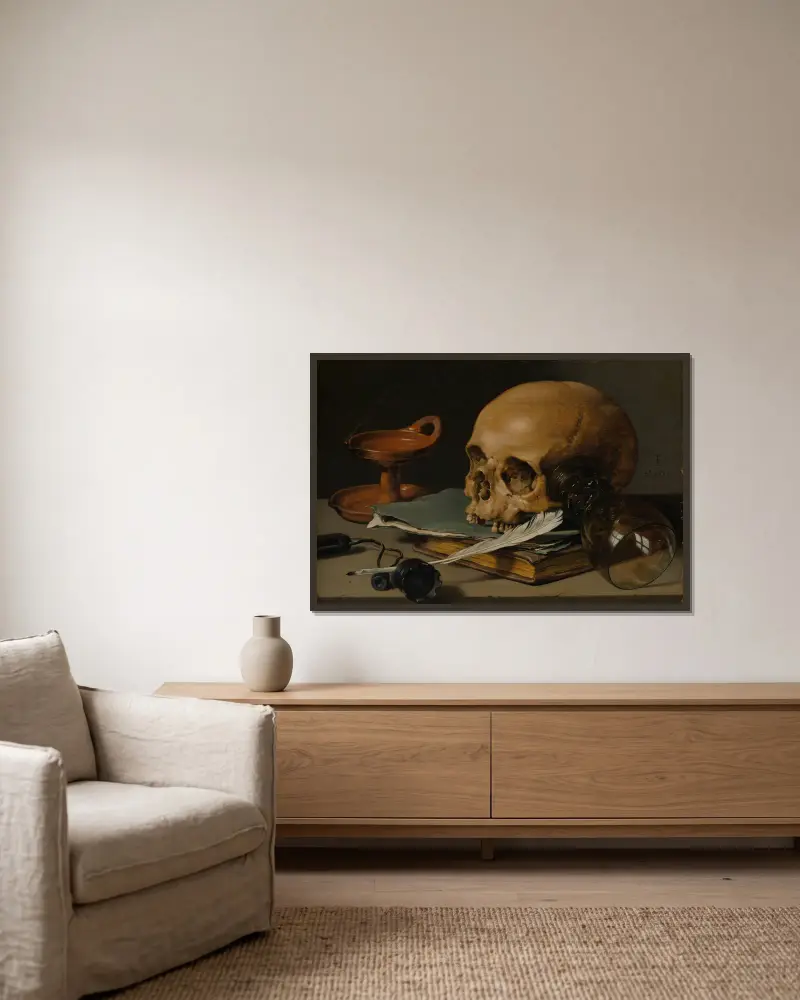 Stilleben med dödskalle och gåspenna av Pieter Claesz inramad på en vägg