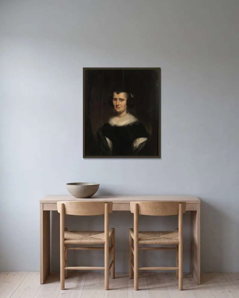 Halvlångt porträtt av en medelålders kvinna av Nicolaes Pietersz. Berchem inramad på en vägg
