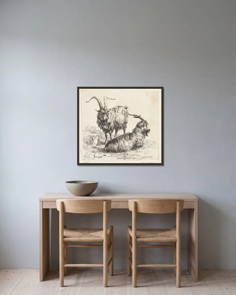 En stående och en liggande get av Nicolaes Pietersz. Berchem inramad på en vägg