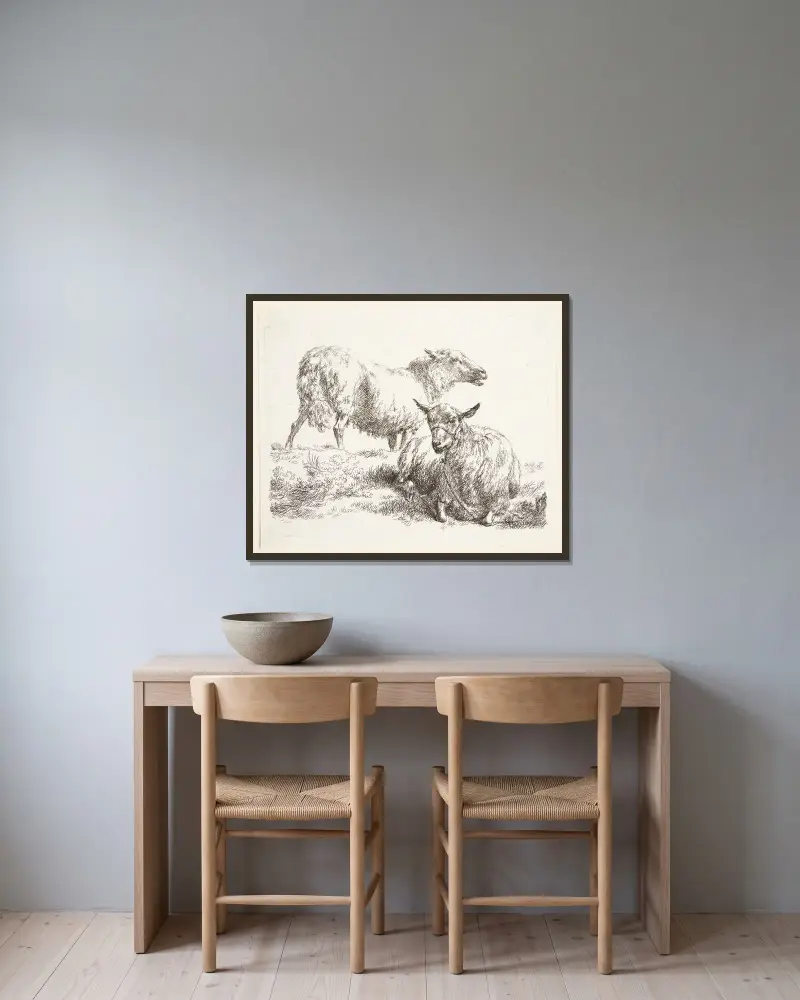 Ett stående och ett liggande får av Nicolaes Pietersz. Berchem inramad på en vägg