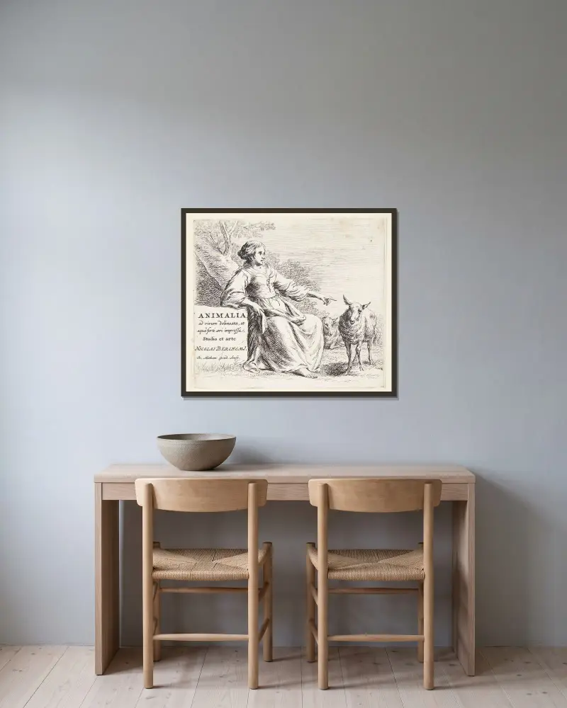 Herdeflicka med ett får. Titelblad till Får av Nicolaes Pietersz. Berchem inramad på en vägg