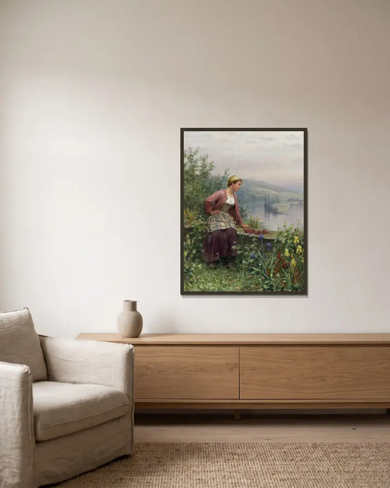 Brittany Girl Overlooking A Stream av Daniel Ridgway Knight inramad på en vägg
