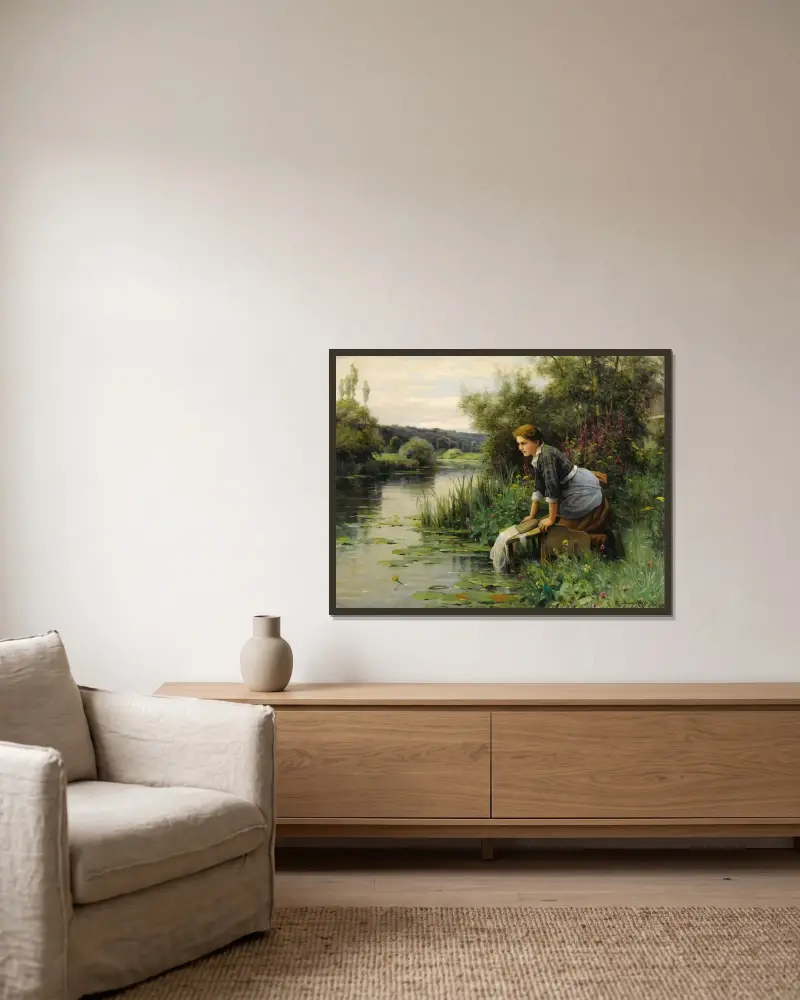 Tvätterska vid vattnet av Daniel Ridgway Knight inramad på en vägg