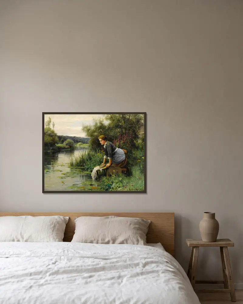Tvätterska vid vattnet av Daniel Ridgway Knight inramad på en vägg