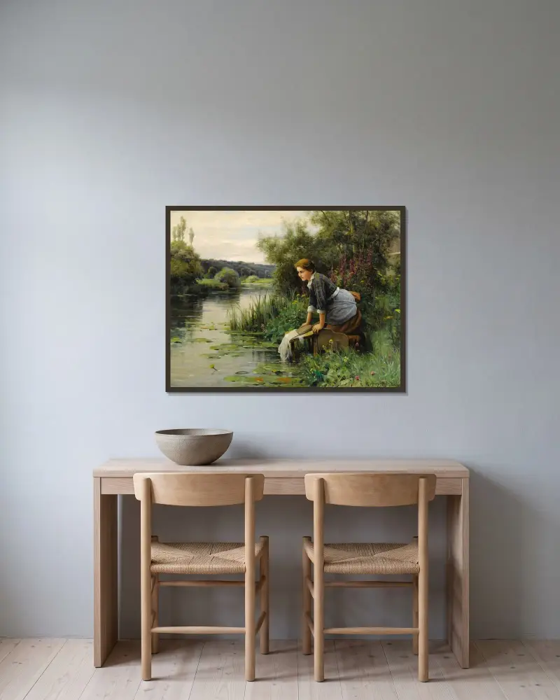 Tvätterska vid vattnet av Daniel Ridgway Knight inramad på en vägg