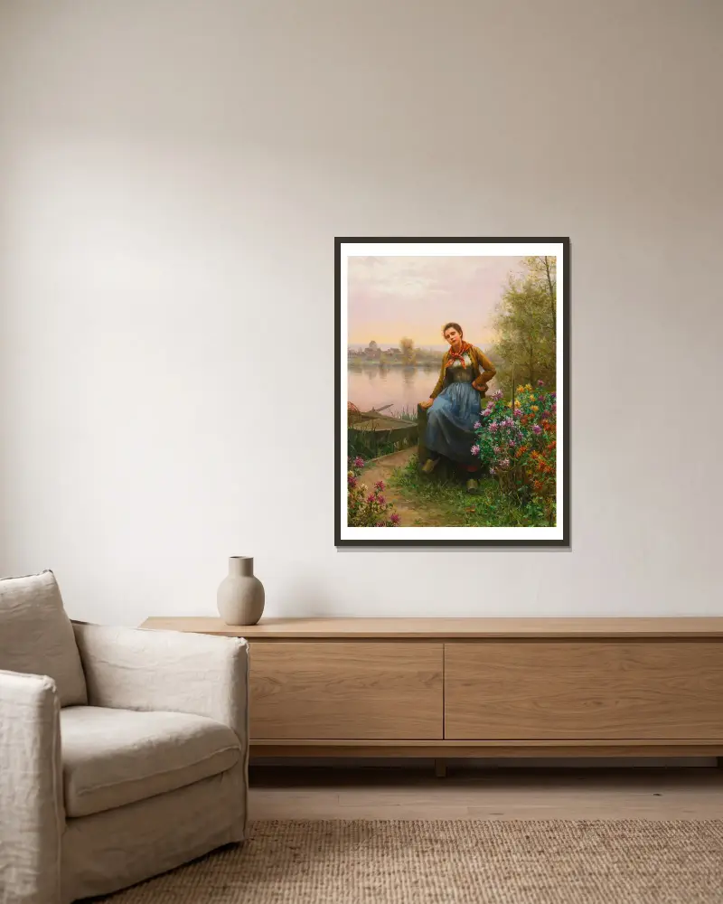 On The River’s Edge av Daniel Ridgway Knight inramad på en vägg