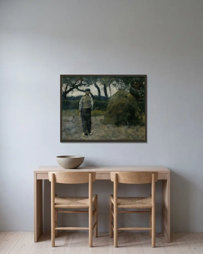 En bonde vid en höstack av Richard Nicolaüs Roland Holst inramad på en vägg