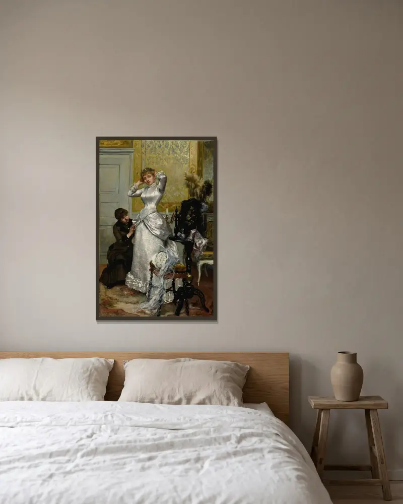 Das Ankleiden der Braut von Rudolf Ernst gerahmt an einer Wand