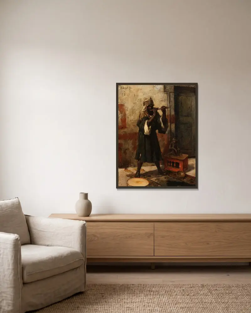 Der Schlangenbeschwörer von Rudolf Ernst gerahmt an einer Wand