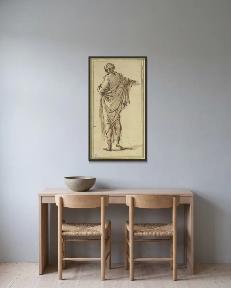 Ein von hinten gesehener Mann, der nach rechts zeigt von Salvator Rosa gerahmt an einer Wand