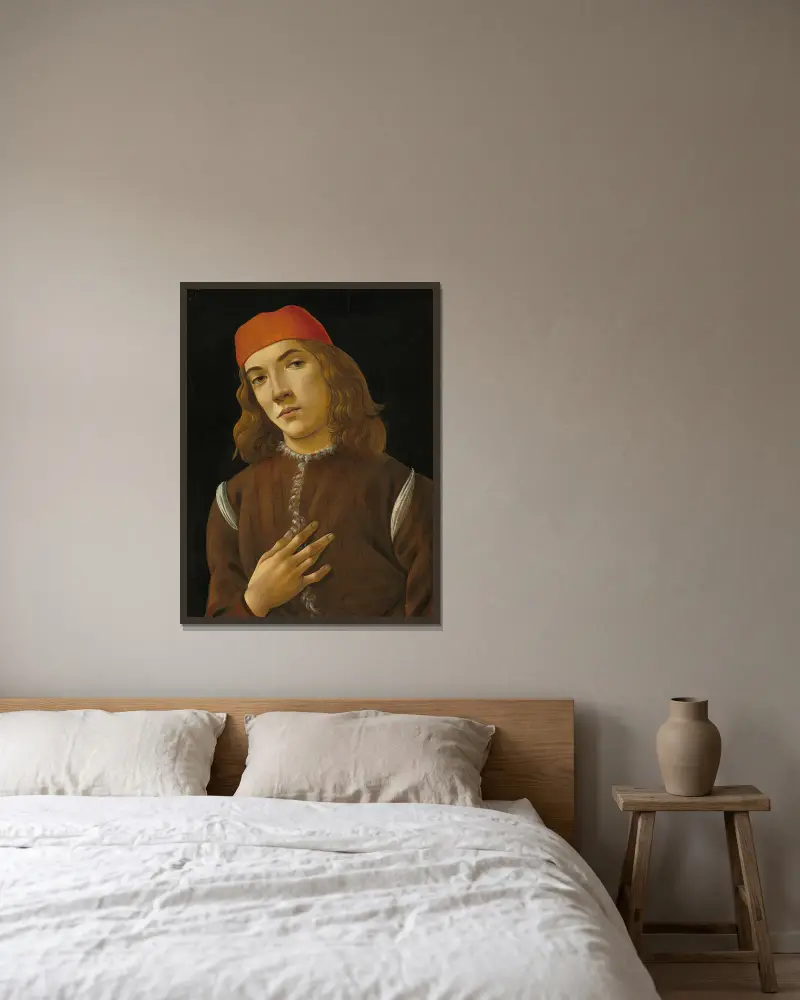 Portrait of a Youth av Sandro Botticelli inramad på en vägg
