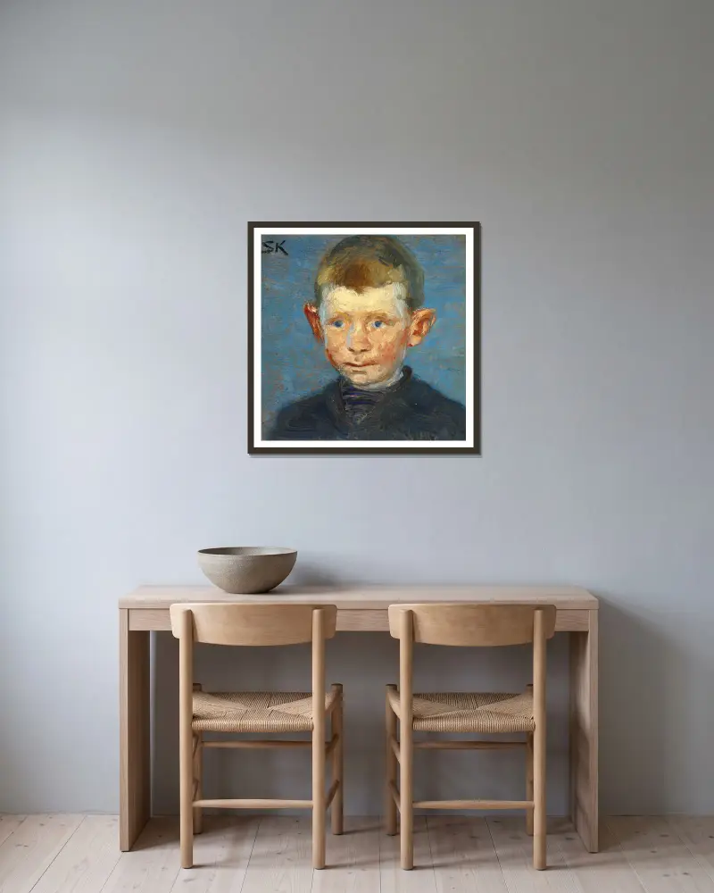 Hoved af en dreng av Peder Severin Krøyer inramad på en vägg