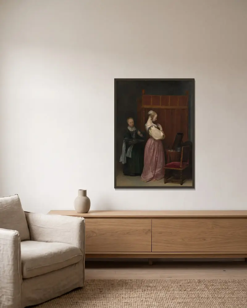 Ung kvinna vid sin toalett med en tjänarinna av Gerard ter Borch inramad på en vägg