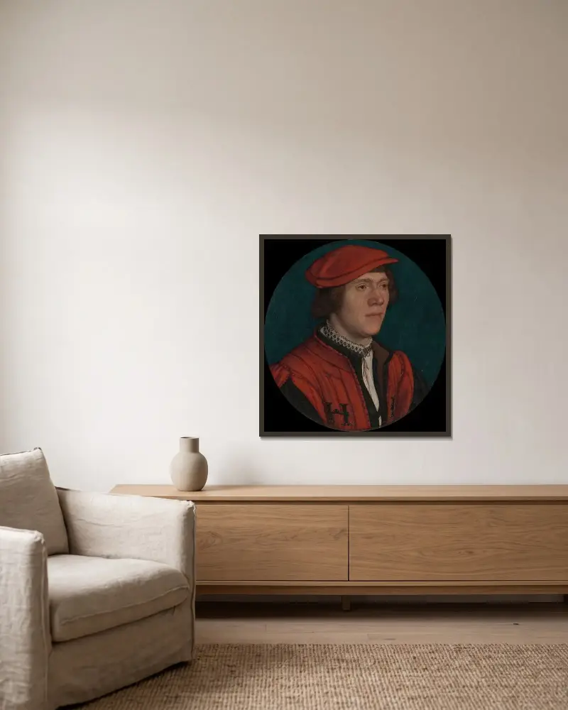 Porträt eines Mannes mit roter Mütze von Hans Holbein The Younger gerahmt an einer Wand