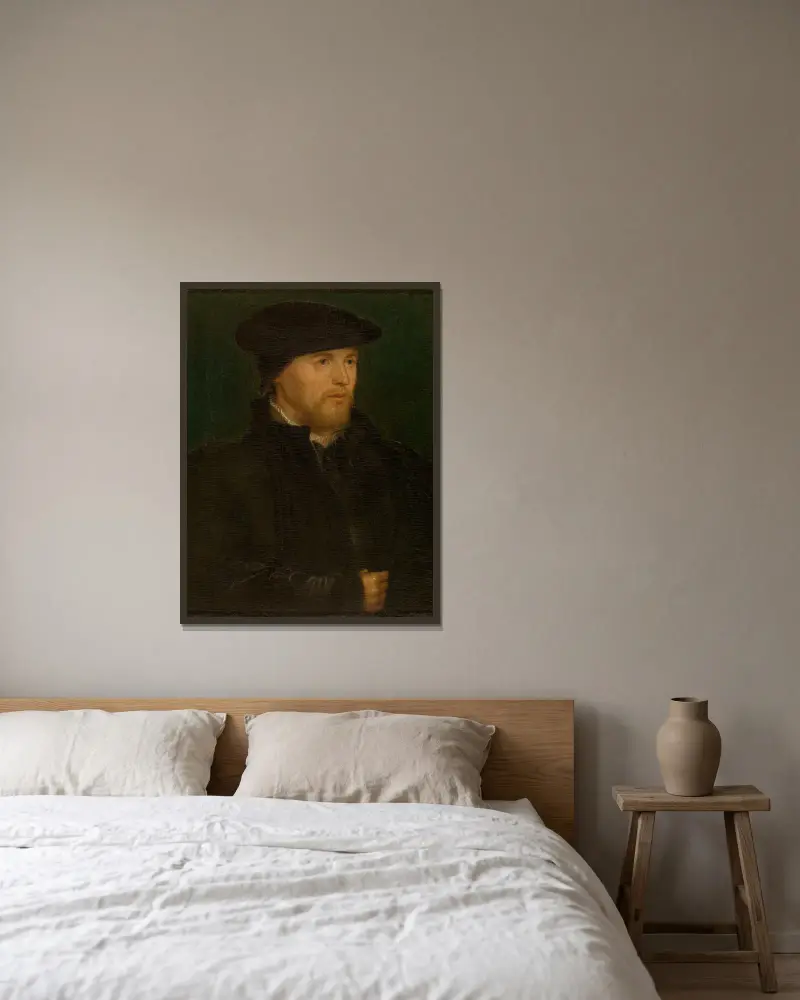 Portrait of a Man av Hans Holbein The Younger inramad på en vägg
