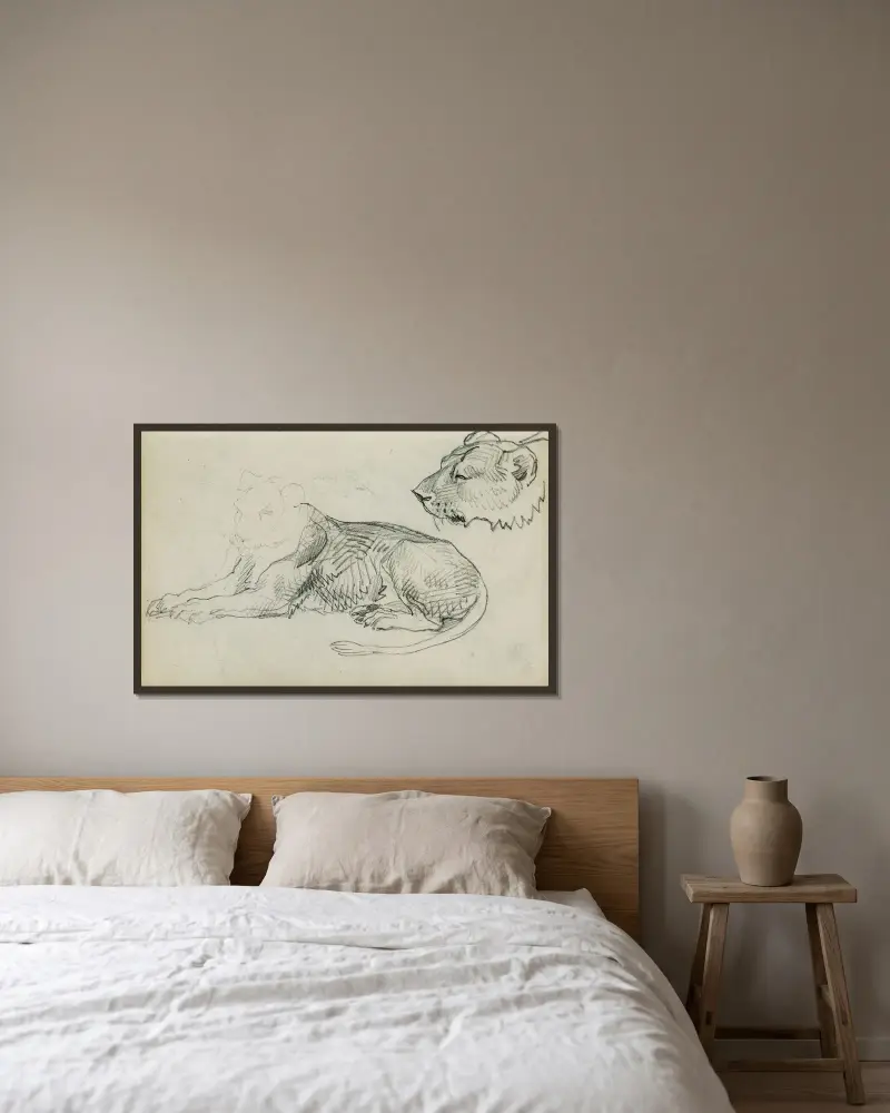 Sittande lejon, lejonhuvud av Théodore Géricault inramad på en vägg