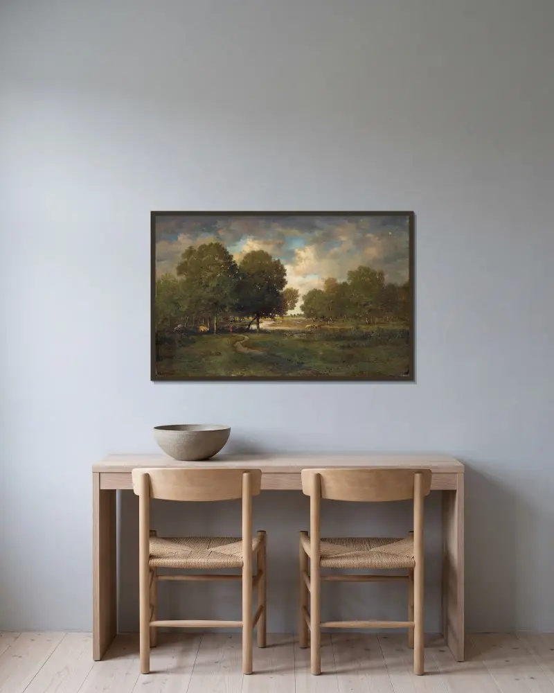 En flod i en äng av Théodore Rousseau inramad på en vägg