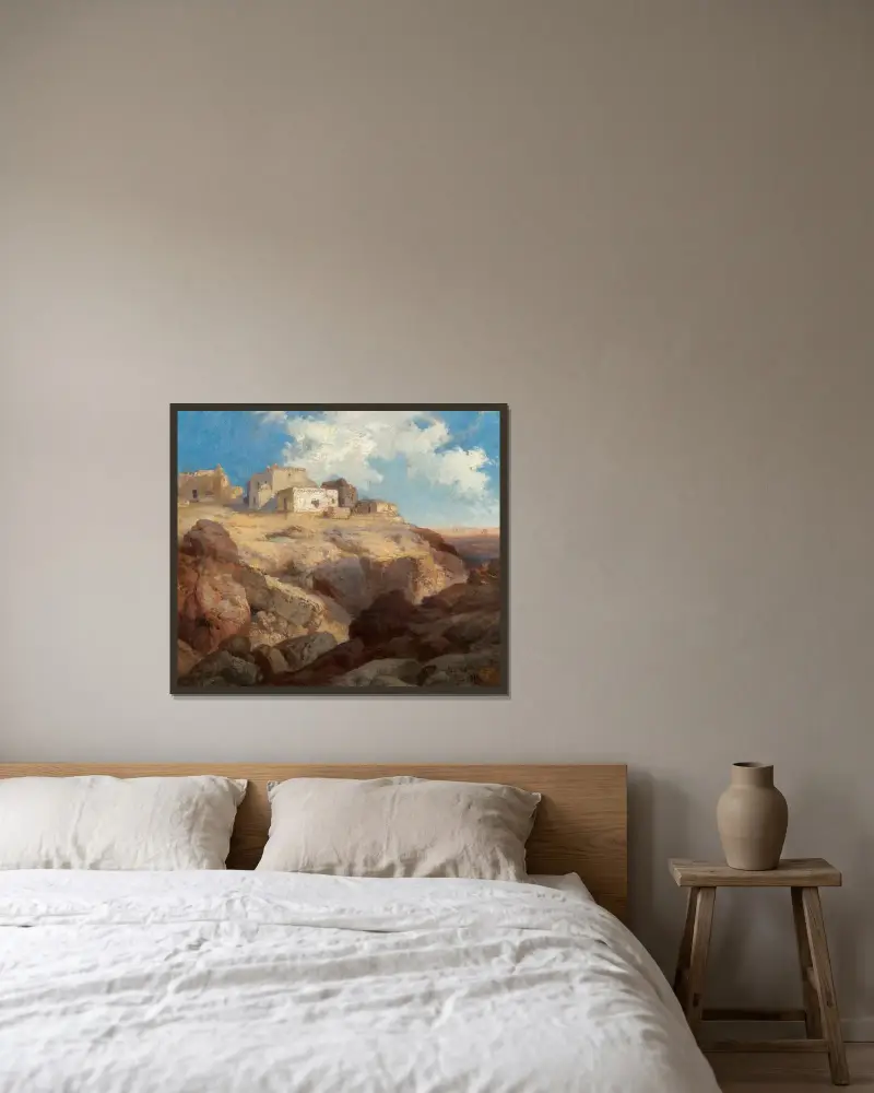 En bit av Acoma, New Mexico av Thomas Moran inramad på en vägg