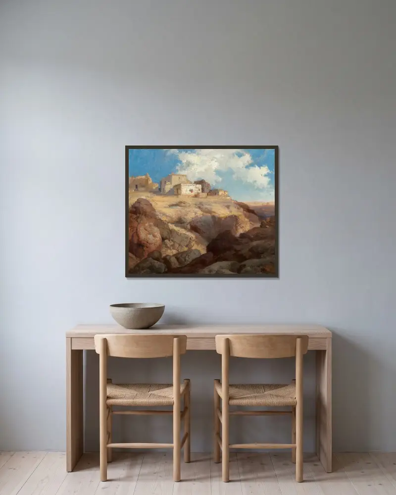 En bit av Acoma, New Mexico av Thomas Moran inramad på en vägg