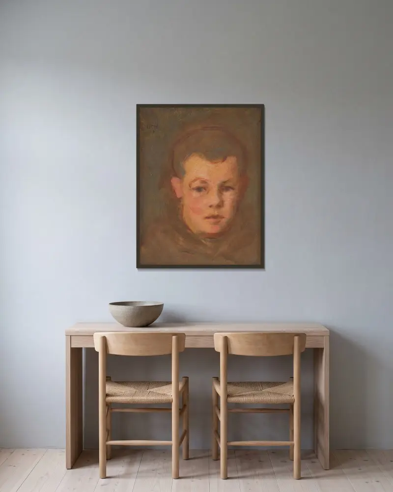 Knabenkopf von Milan Thomka Mitrovský gerahmt an einer Wand