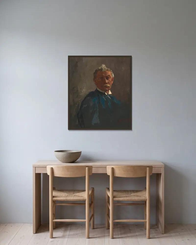 Herrenbildnis von Tina Blau gerahmt an einer Wand