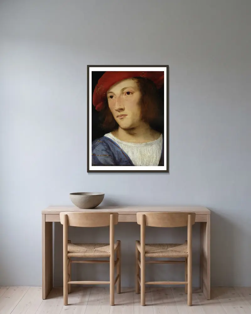 Portrait of a Young Man av Titian inramad på en vägg
