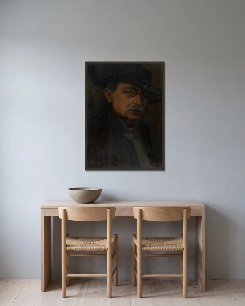 Man med glasögon av Ľudovít Čordák inramad på en vägg