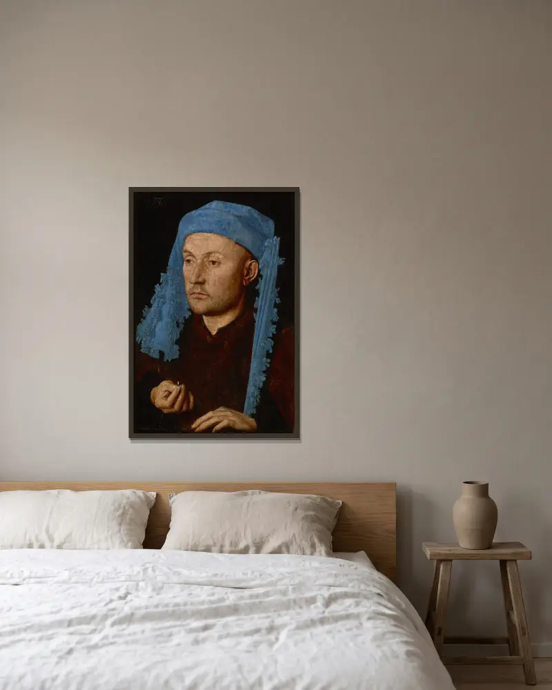 Mann mit blauer Mütze von Jan van Eyck gerahmt an einer Wand