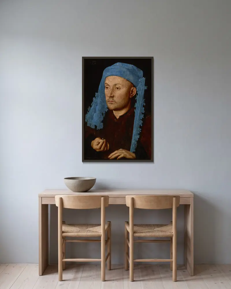 Mann mit blauer Mütze von Jan van Eyck gerahmt an einer Wand