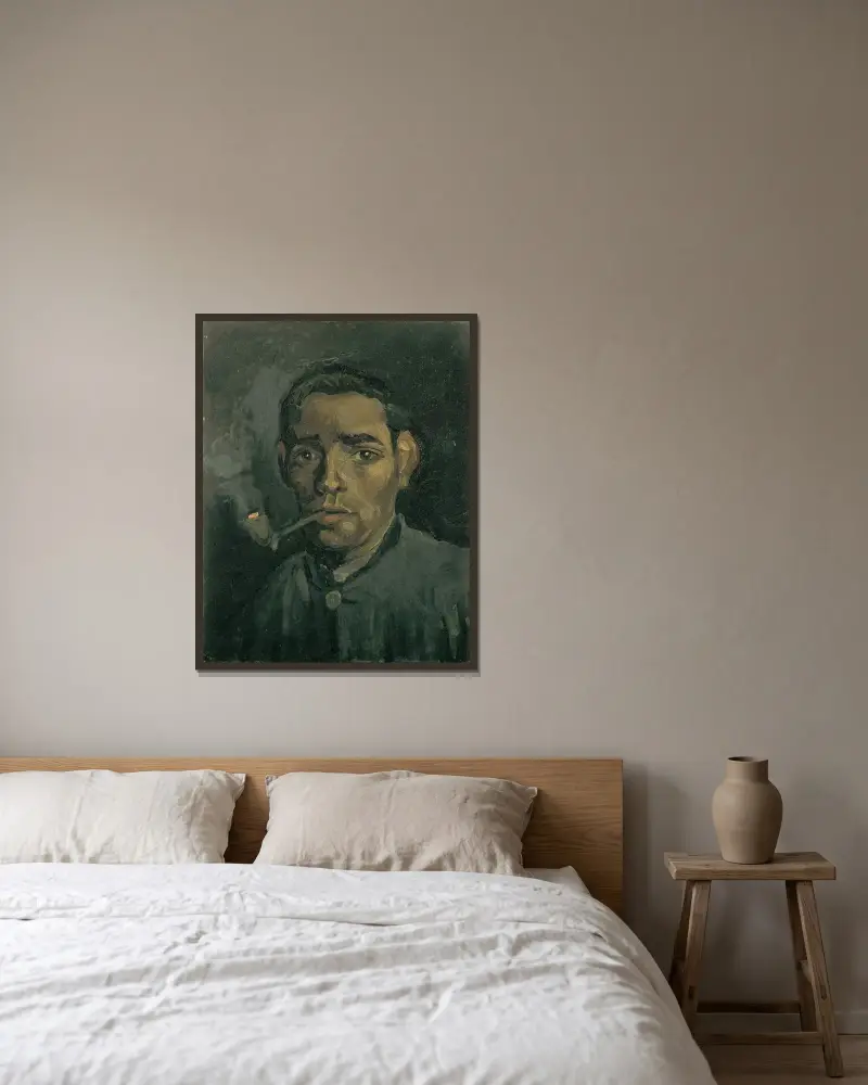 Head Of A Man av Vincent van Gogh inramad på en vägg