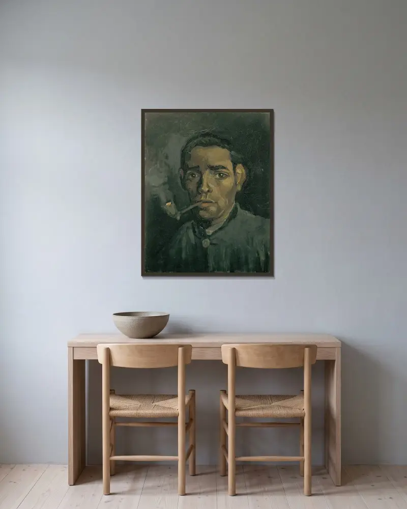 Head Of A Man av Vincent van Gogh inramad på en vägg