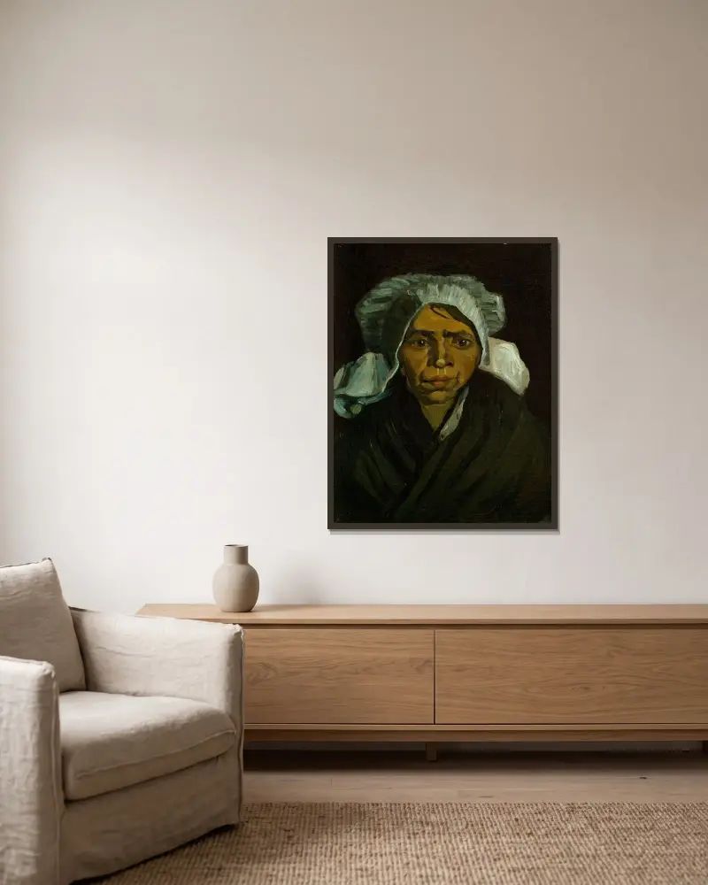 Head of a Peasant Woman av Vincent van Gogh inramad på en vägg