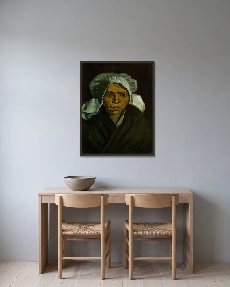 Head of a Peasant Woman av Vincent van Gogh inramad på en vägg