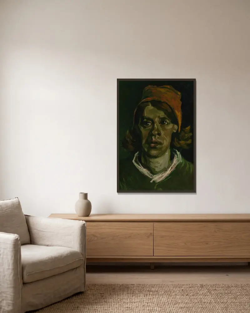 Head of a woman av Vincent van Gogh inramad på en vägg