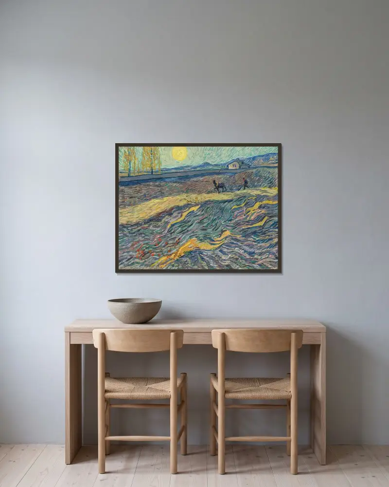 Pflügender Bauer auf einem Feld von Vincent van Gogh gerahmt an einer Wand