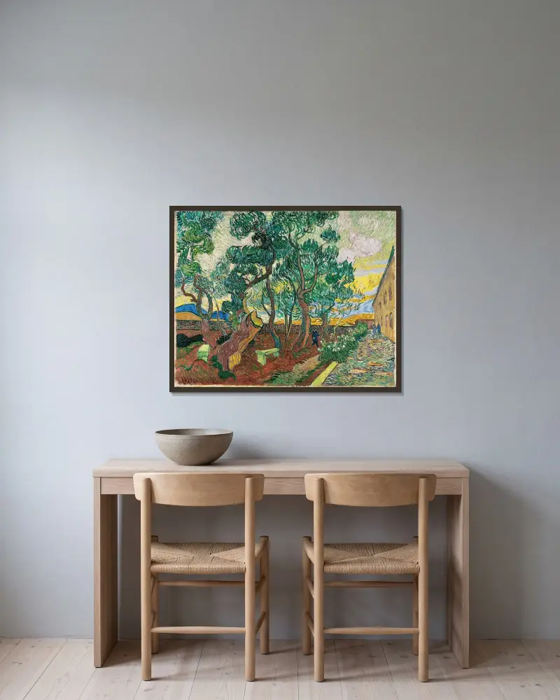 The Garden of Saint-Paul Hospital av Vincent van Gogh inramad på en vägg