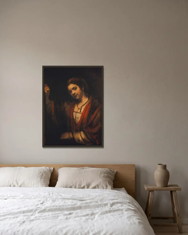 Portrait of Hendrickje Stoffels av Rembrandt van Rijn inramad på en vägg